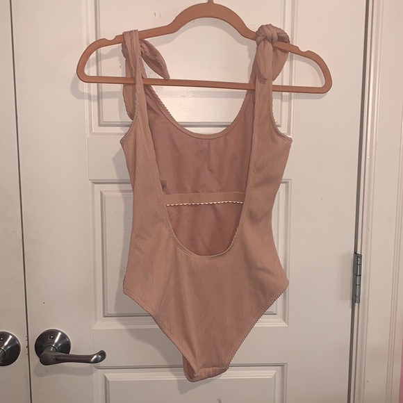 Pink Kensie One Piece with an open back and knots on either shoulder - Picture 2 of 3